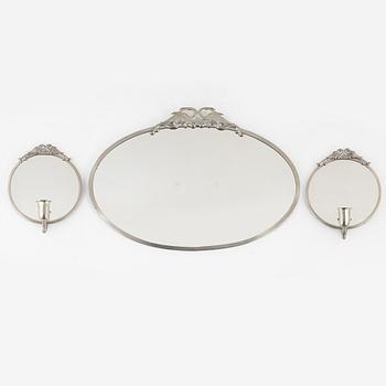 A Swedish Grace mirror and a pair of wall sconces, 1920's-30's.
