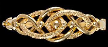 909. A handmade gold bangle/bracelet.