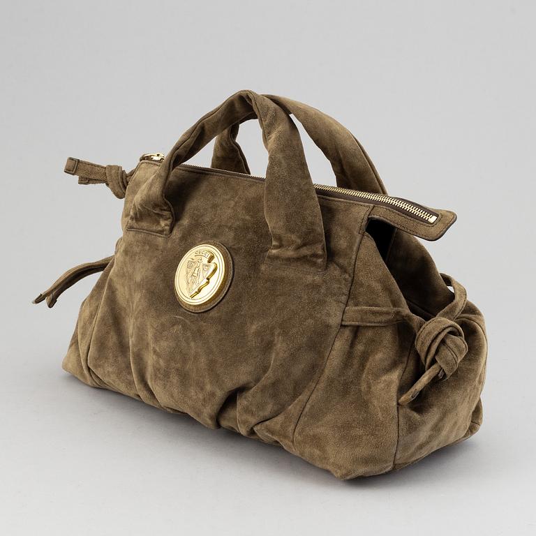 Gucci, a suede bag.