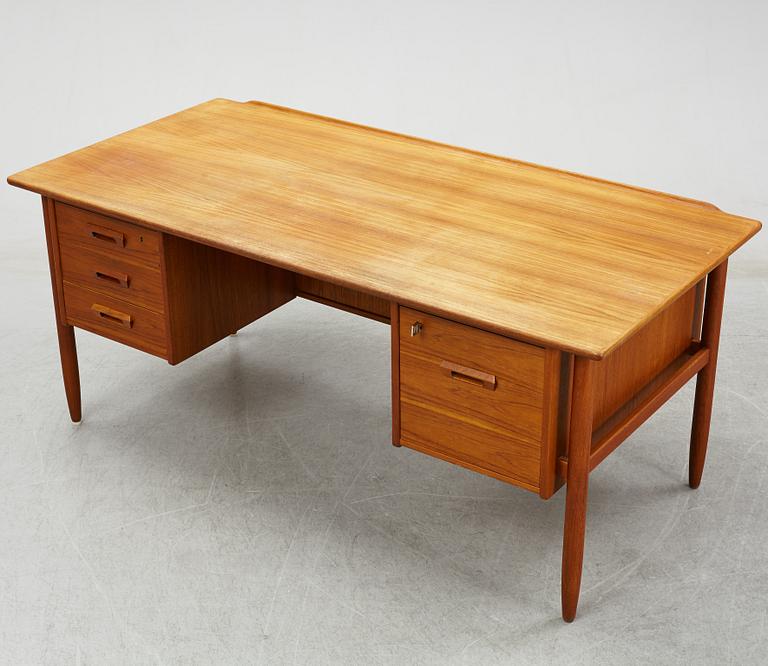 A 1950/60's teak writing desk.