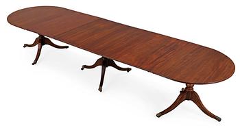 An English Regency and later mahogany dining table.
