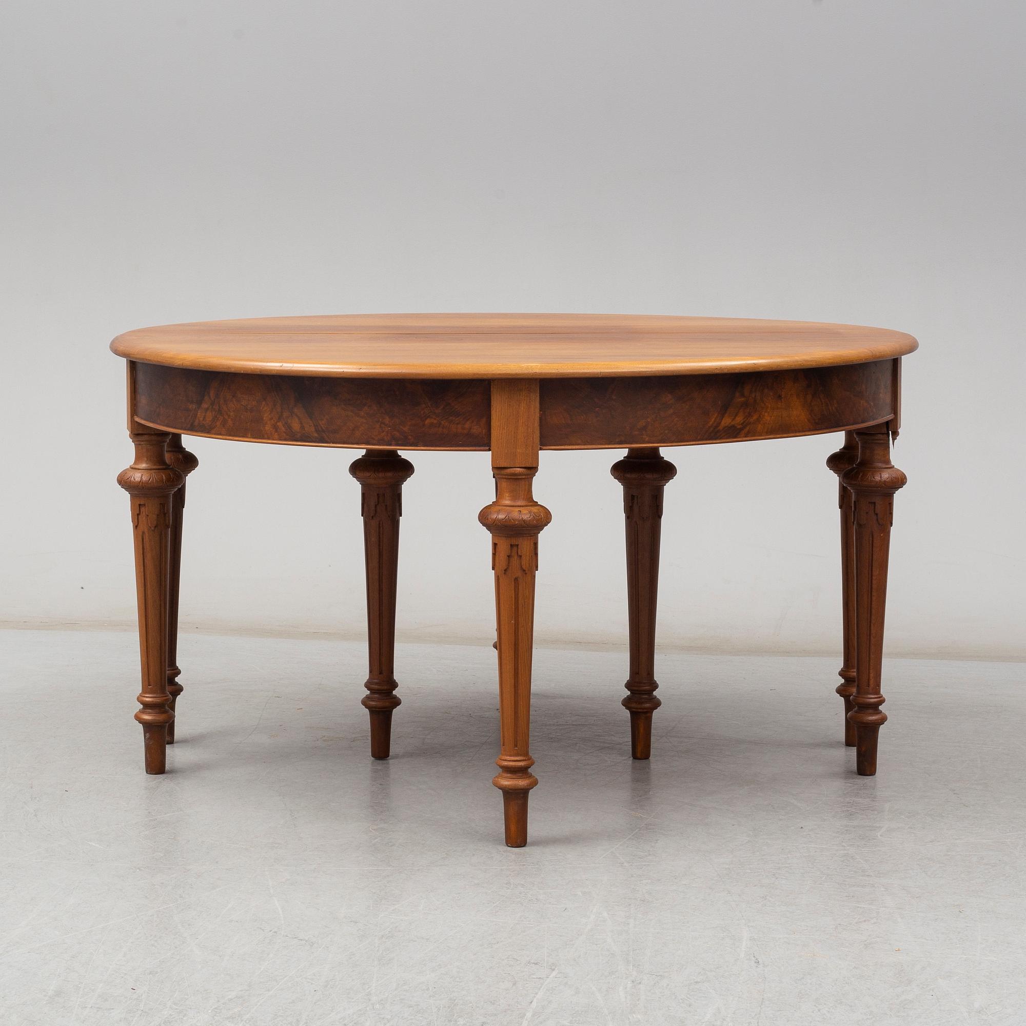 A DINING TABLE, second half of the 19th century. 5 painted leaves included.