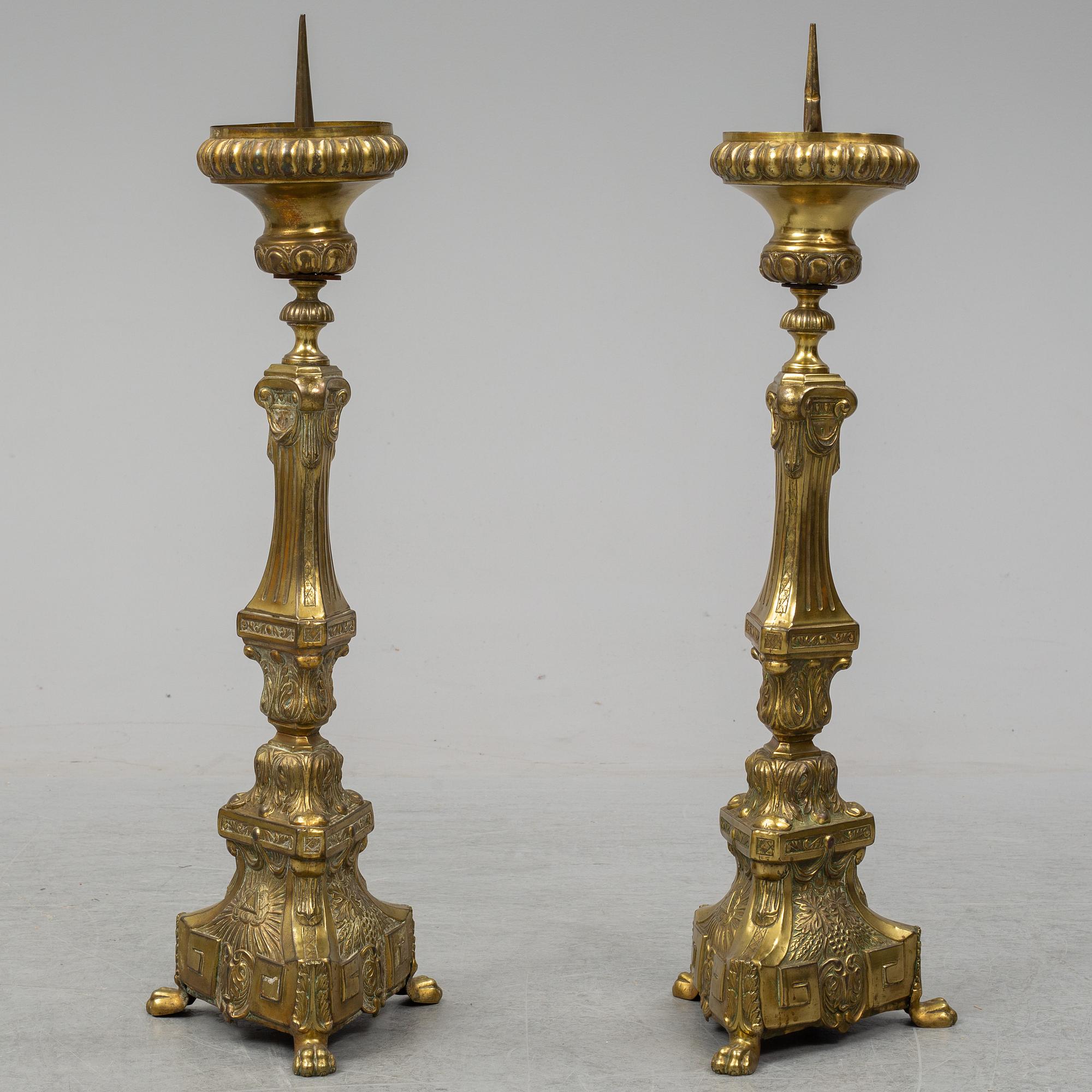 A pair of 18th century brass floor candlesticks.