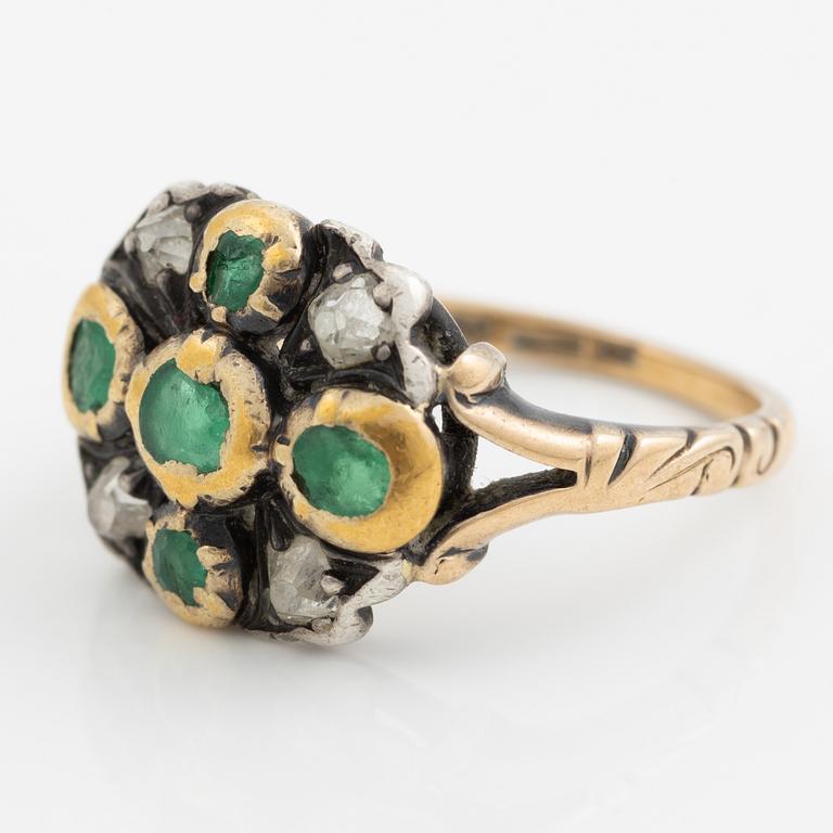 Ring 18K gold and silver set with old-cut diamonds and green stones.