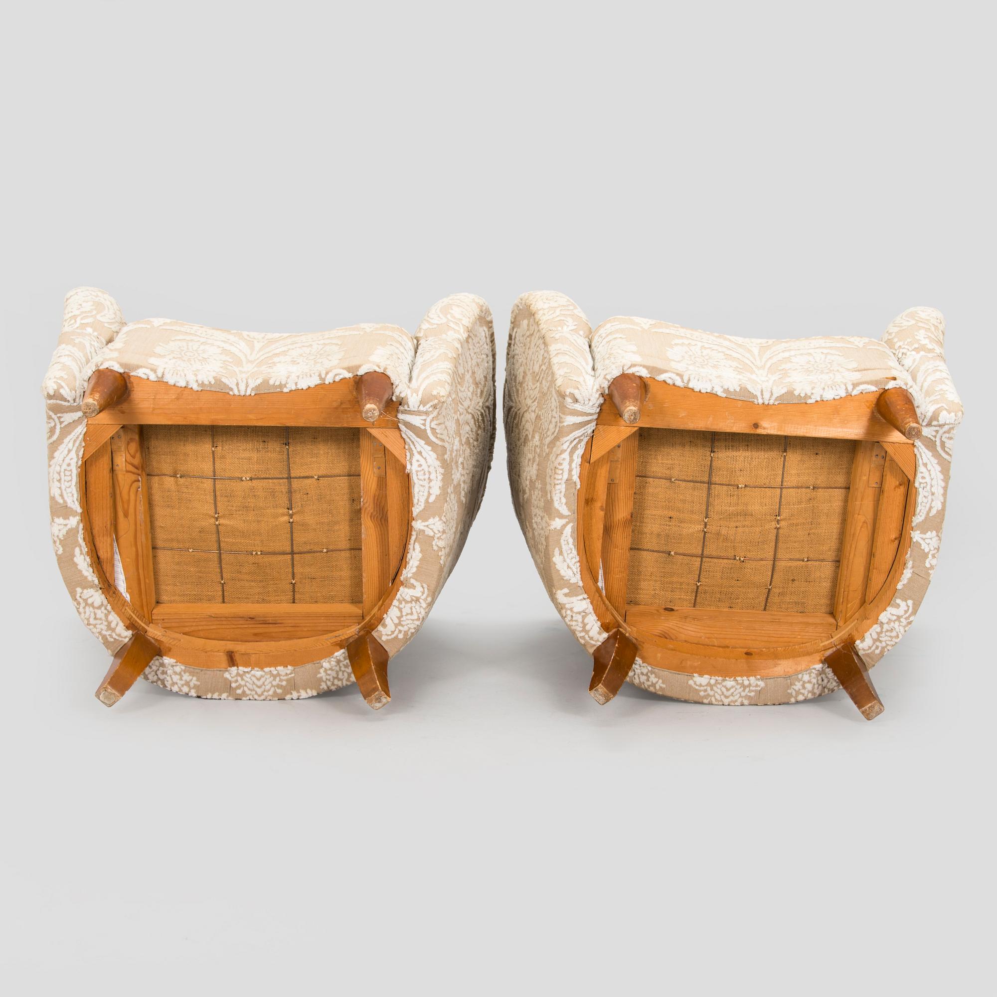A pair of mid-20th century armchairs.