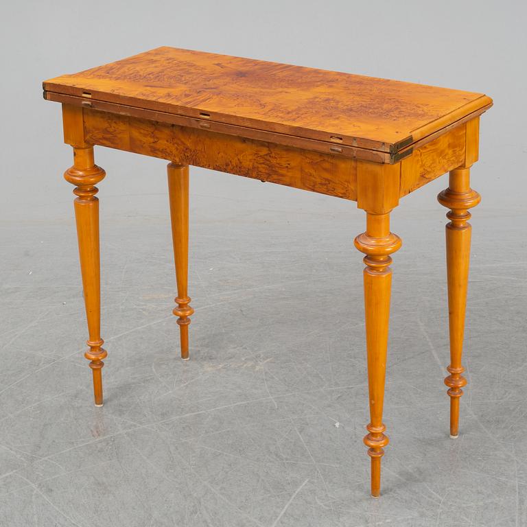 An early 20th Century birch card table.