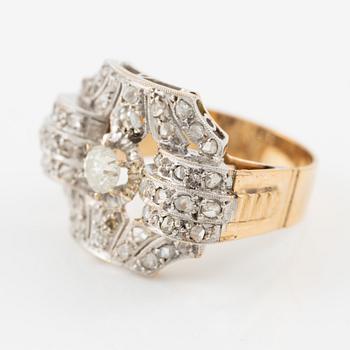 Ring in 18K gold and platinum set with an old-cut diamond and rose-cut diamonds.