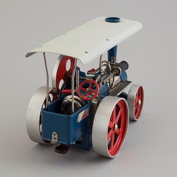 a Wilesco traktor painted tin car from the mid 20th century.