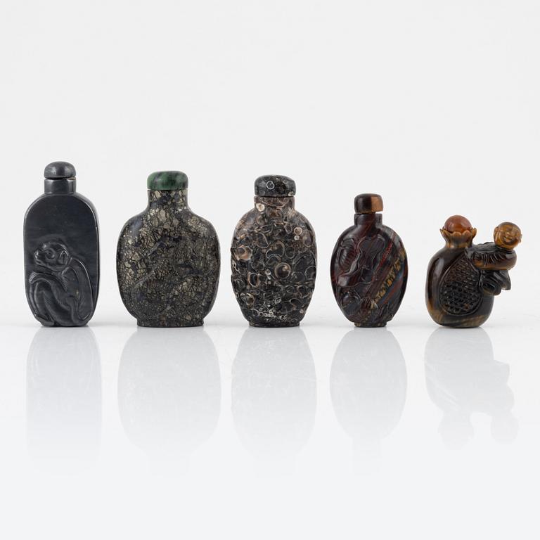 Ten snuff bottles, mottled stone, China, 20th century.