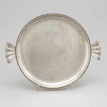 A pewter plate from Svenskt Tenn, Stockholm, 1930.