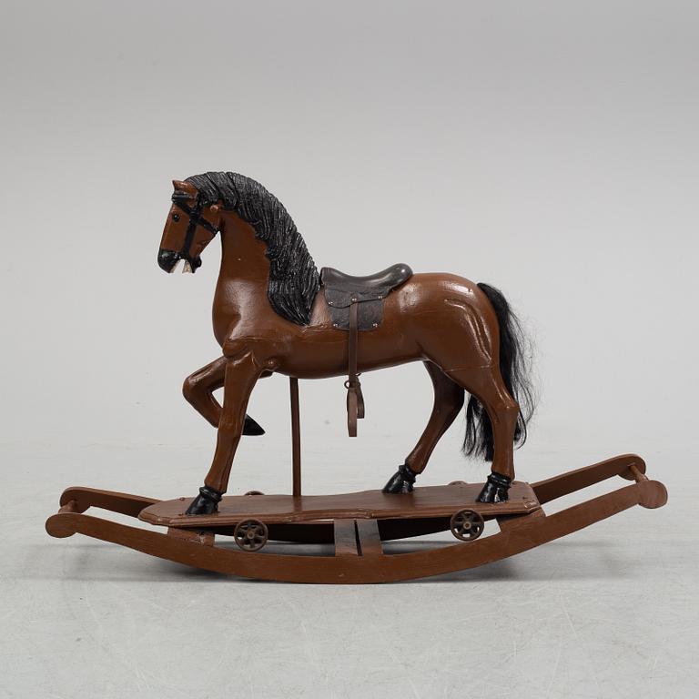 A painted rocking horse from around 1900.