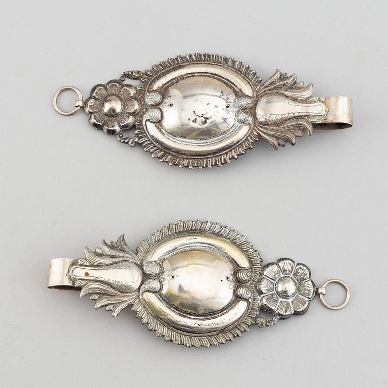 A pair of 19th century silver curtain tie-backs.