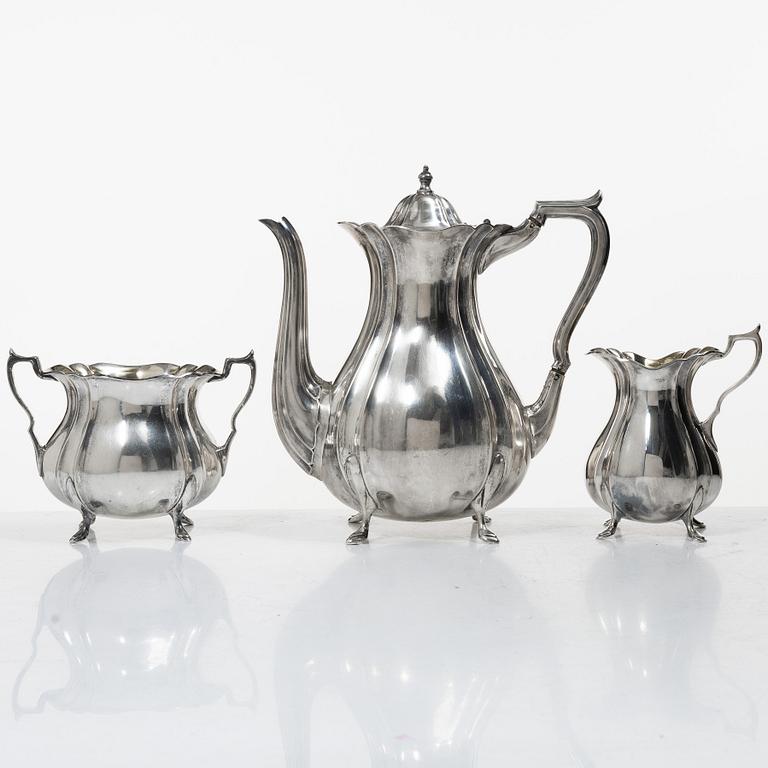 Guldsmedsaktiebolaget (GAB), A Swedish Rococo style silver coffee pot, cream jug and sugar bowl, mark of GAB, Stockholm 1918-1919.