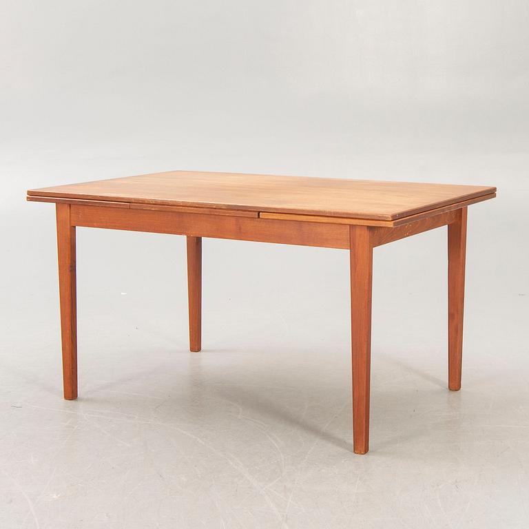 A Danish 1960s teak dining table.