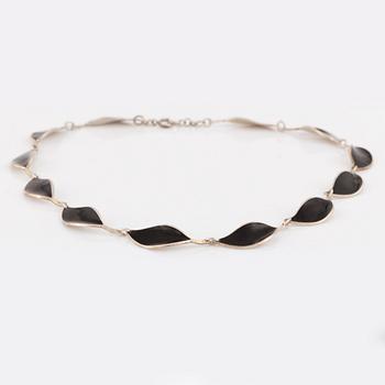 David Andersen, necklace and two brooches, silver and enamel.