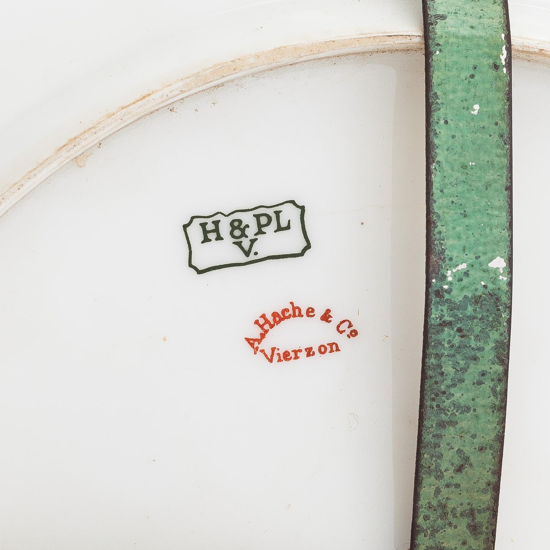 A pair of porcelain plates for Hache & Co, France.