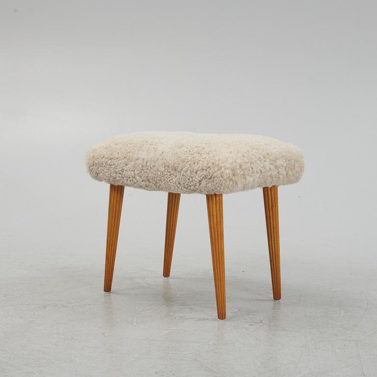 A sheepskin upholstered stool, mid 20th Century.
