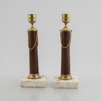 A pair of late Gustavian gilt brass, marble and birch candlesticks, circa 1800.