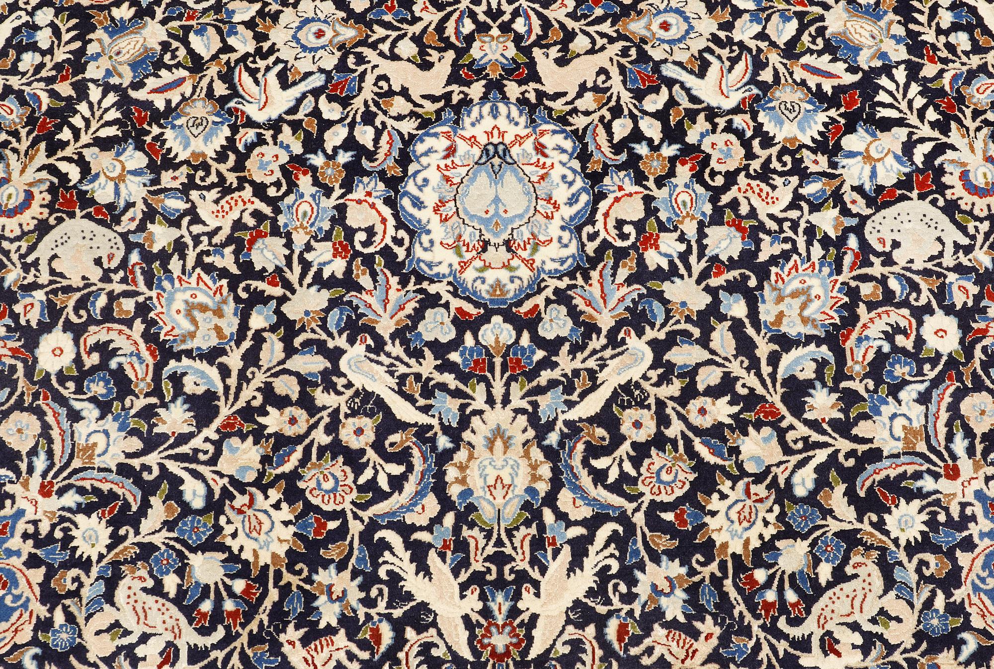 A Nain carpet, part silk, so-called 6 LAA, approx. 324 x 210 cm.