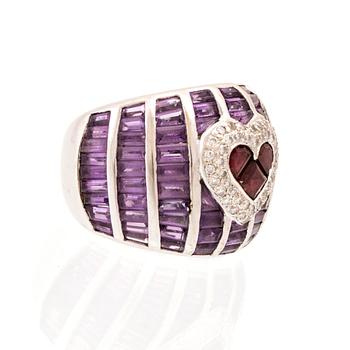 An 18K white gold Cocktail ring set with round brilliant-cut diamonds, step-cut amethysts and garnets.