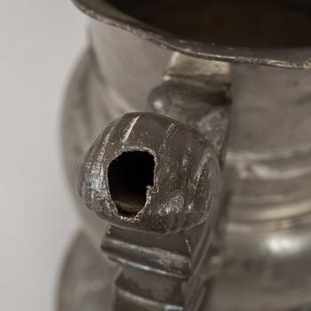A pewter jug, probably 17th century.