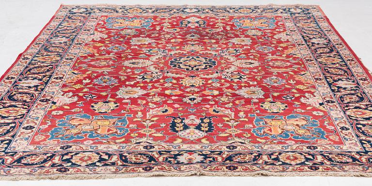 A semi-antique Tabriz carpet, c 358 x 248 cm.