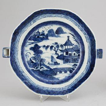 A set of three blue and white plates and a hot water dish, Qing dynasty, 18th/19th Century.