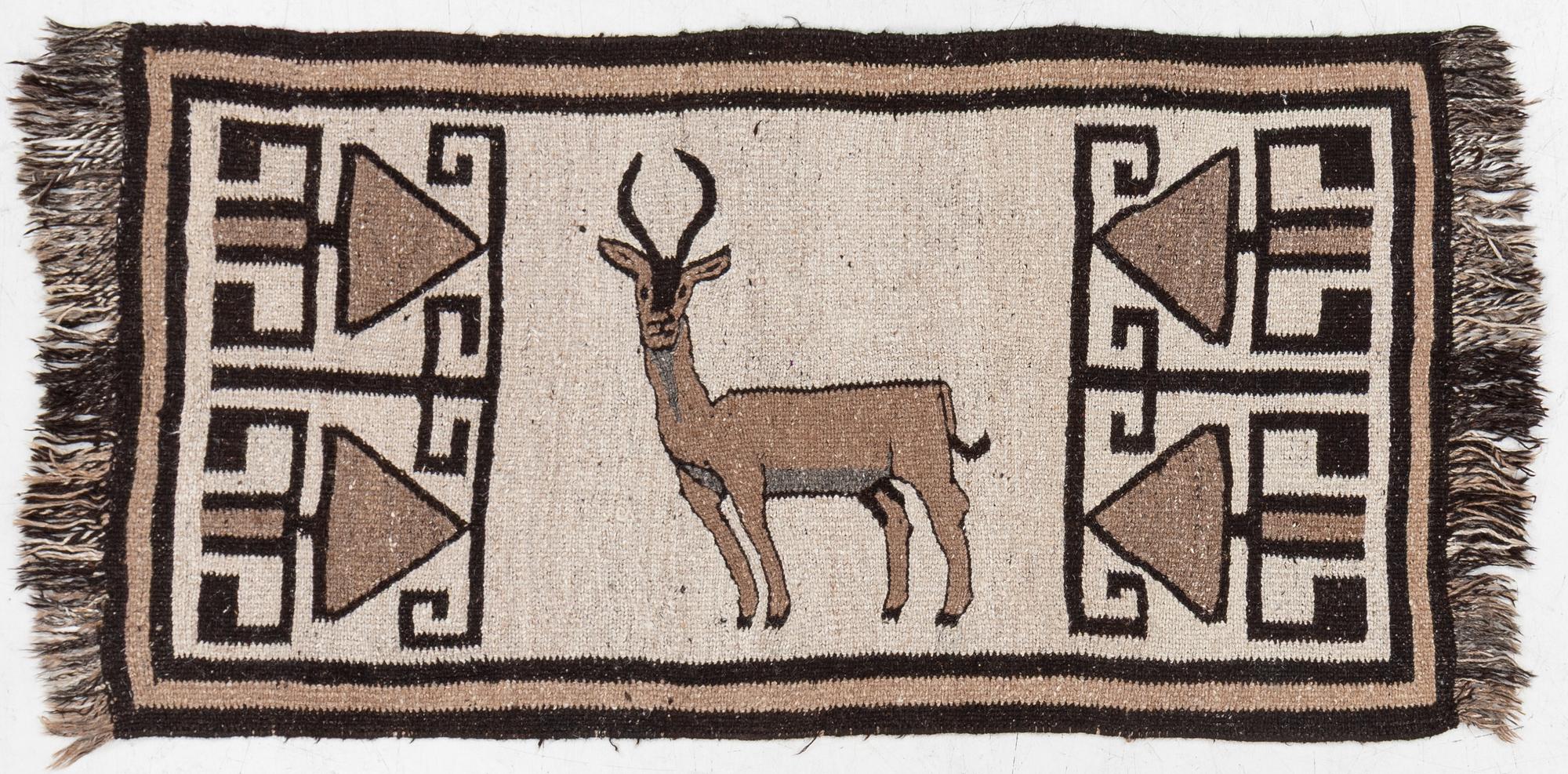 An oriental rug, c. 185 x 100 cm.