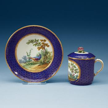 828. A Sèvres cup with cover and stand, 18th Century.