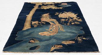 A Chinese ’phoenix rug’, 20th century, c. 181 x 93 cm.