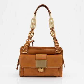 Balenciaga, a camel leather bag.