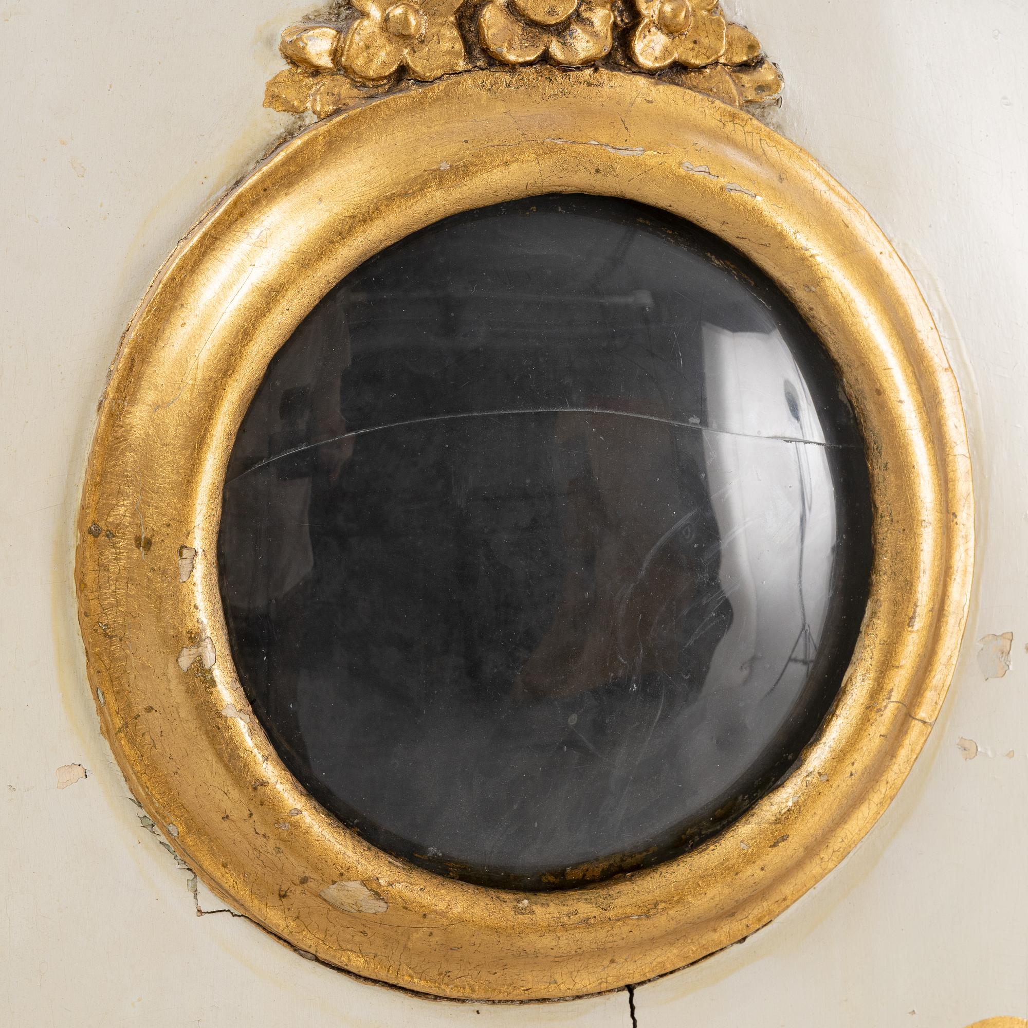 A long-case clock, 19th century.
