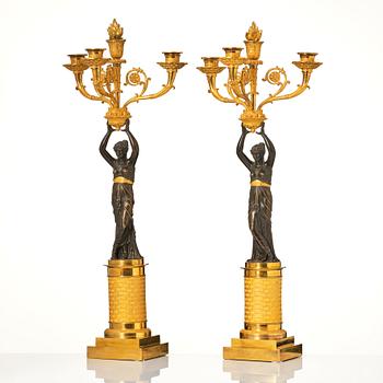 A pair of French Empire four-light candelabra, attributed to Francois Rabiat (bronze maker in Paris 1756-1815).