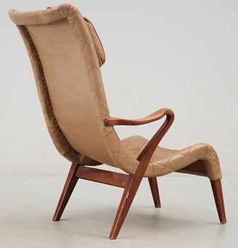 An Axel Larsson birch and leather easy chair, Bodafos, 1940's, model 1207.