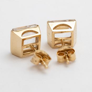 A pair of 18K gold earrings with rock crystal stones.