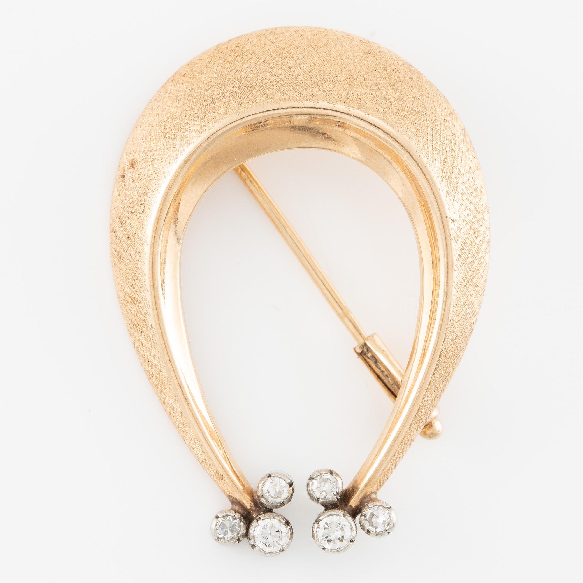 Brosch 14K guld med runda briljantslipade diamanter.