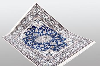 A Nain rug, part silk, ca 205 x 152 cm.