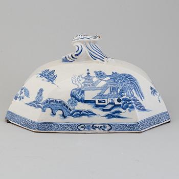 An 18th century faience cover.