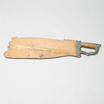 A wooden tool from Hälsingland, dated 1838.