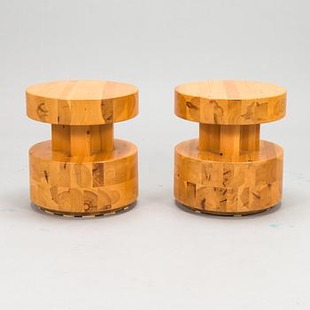 A pair of Finnish pinewood stools/ sidetables, late 20th century.