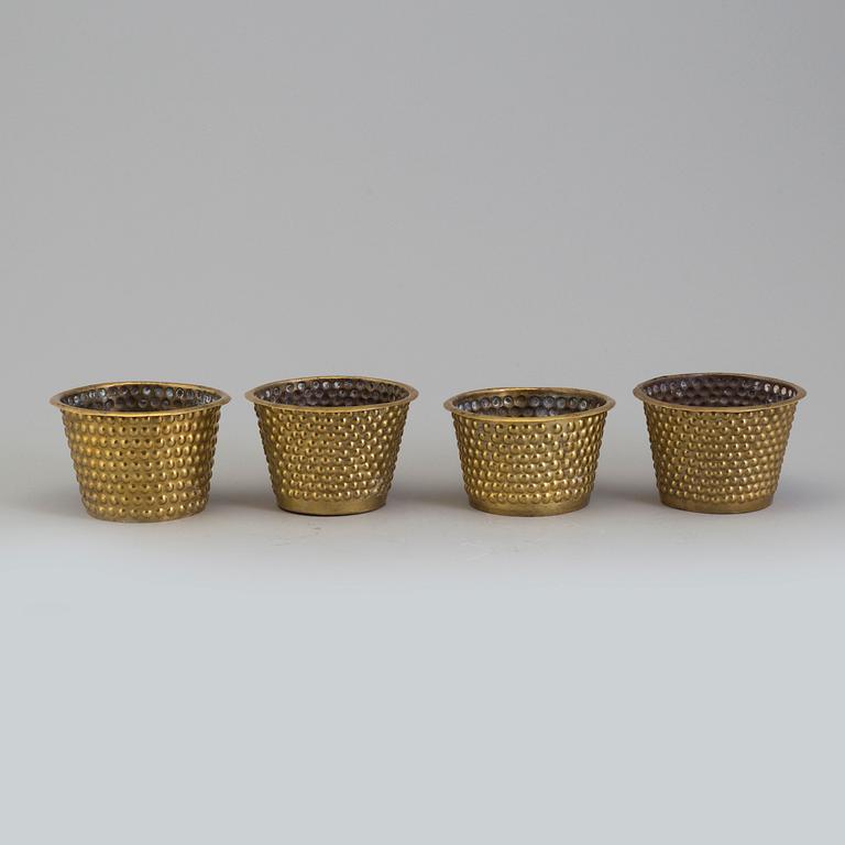 A set of four brass flower pots by Josef Frank for Firma Svenskt Tenn.