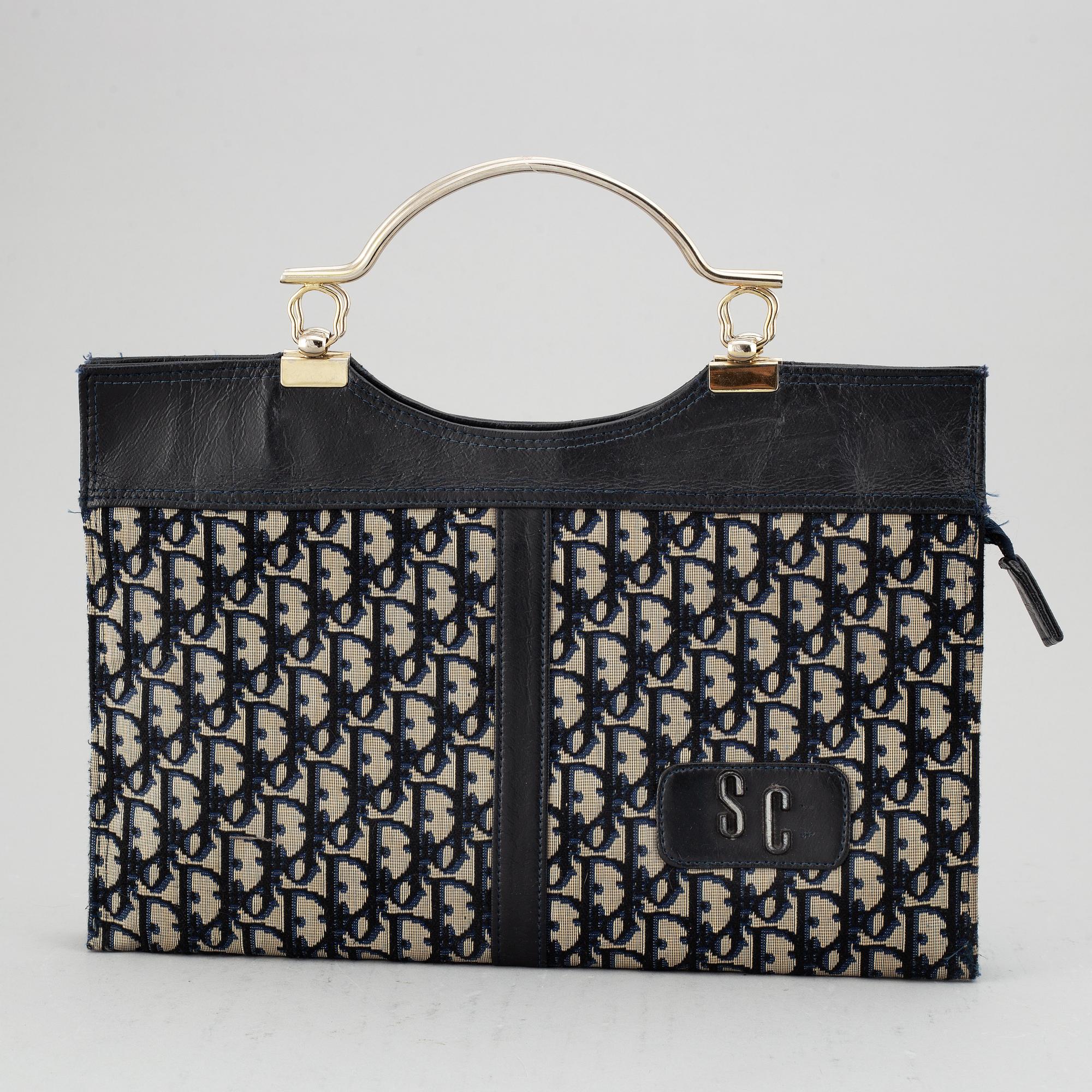 CHRISTIAN DIOR, a monogram canvas handbag.