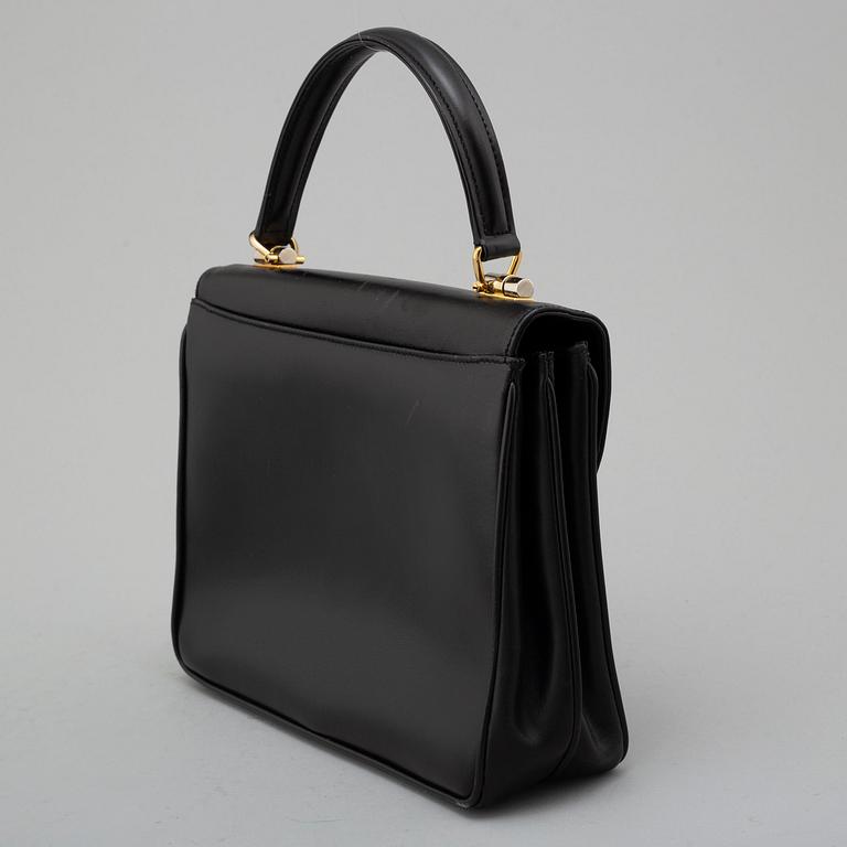 GUCCI, black leather bag.