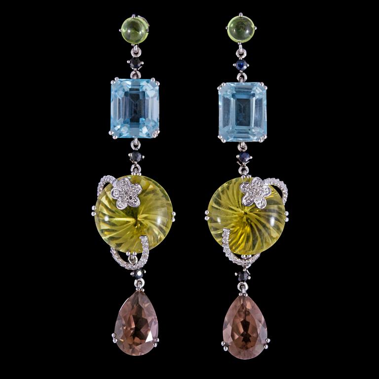A pair of aquamaringe and citrine earrings.
