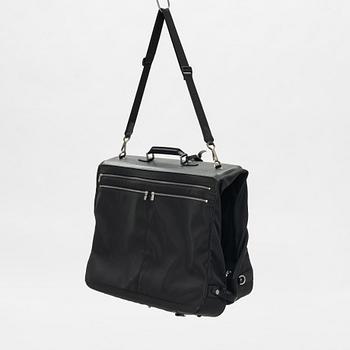 Louis Vuitton, a green canvas and Taiga garment bag.