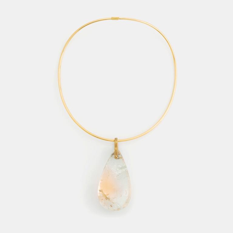 A Tina Karlsson 18K gold necklace with a large quartz drop.