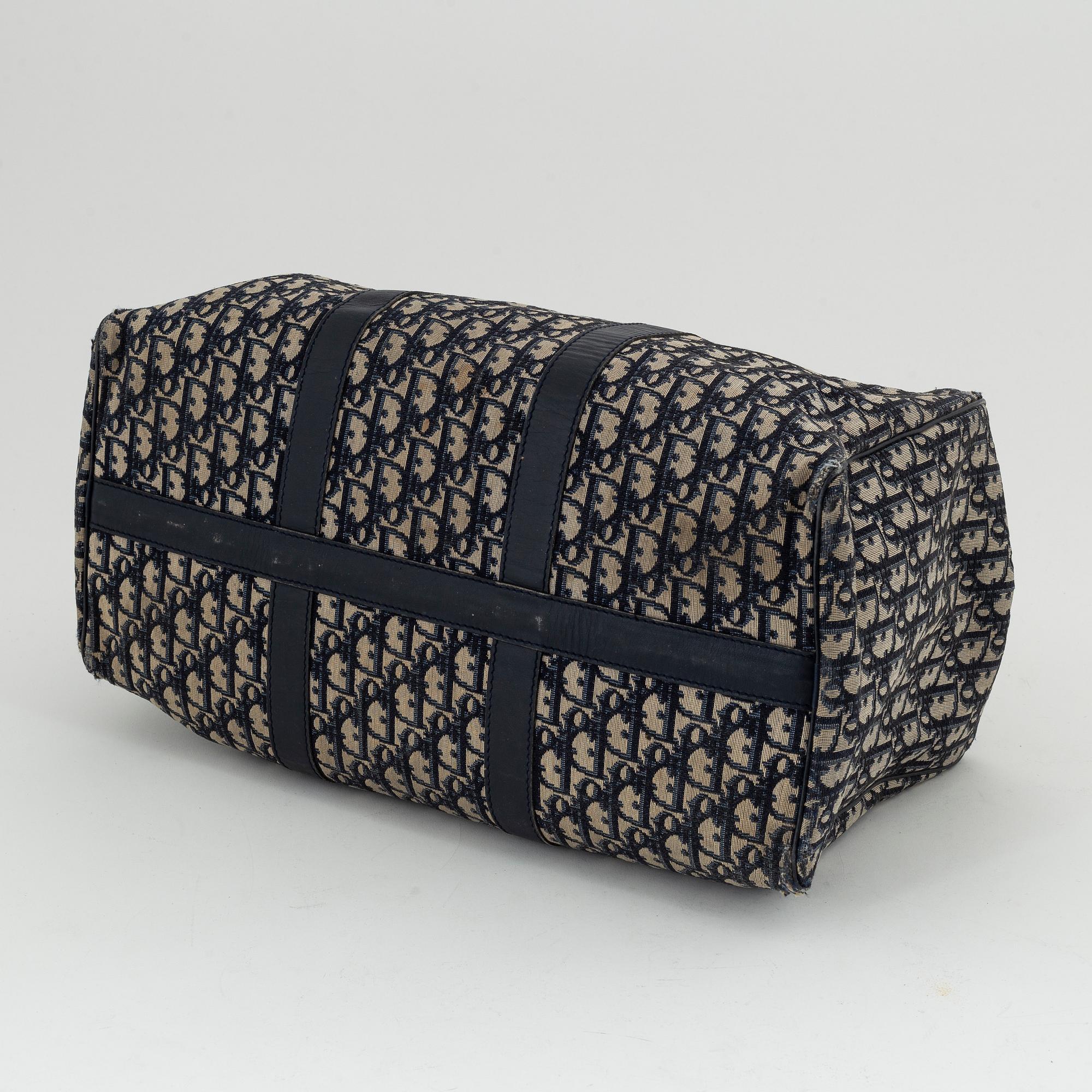 Christian Dior, a canvas 'Speedy' weekendbag and belt, size 85.