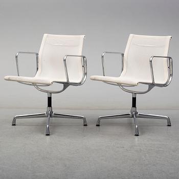 A pair of EA 107 chairs by Charles & Ray Eames, Vitra.