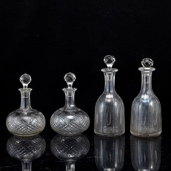 A set of four bottles with stoppers, 20th Century.