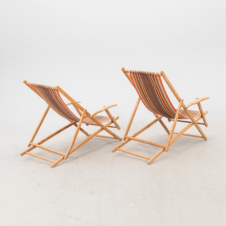 A pair of mid 1900s sun chairs.